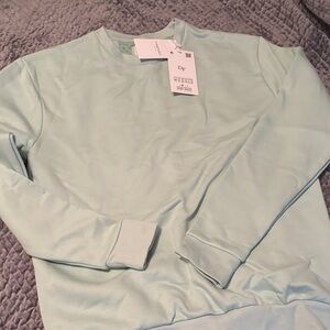 Light teal crewneck sweatshirt
New with tags!